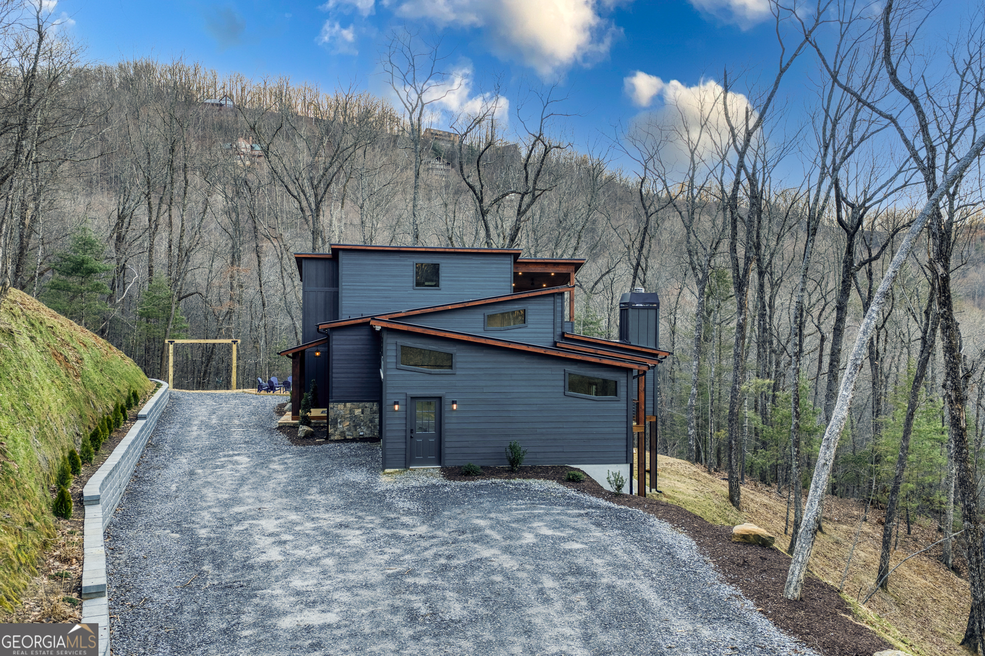 1160 Mangum's Trail Blue Ridge, GA 30513 - Photo 69 of 75 a view of a house with a yard and roof