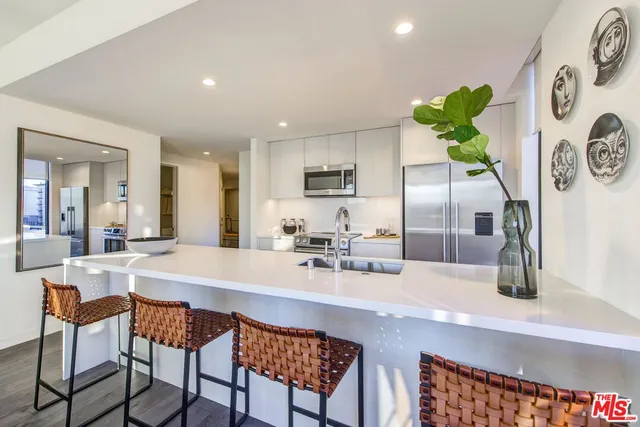 a kitchen with a stove and a sink