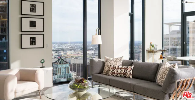 a bedroom with a bed and a mirror