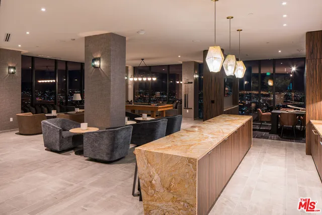 a living room with furniture a rug and a large window