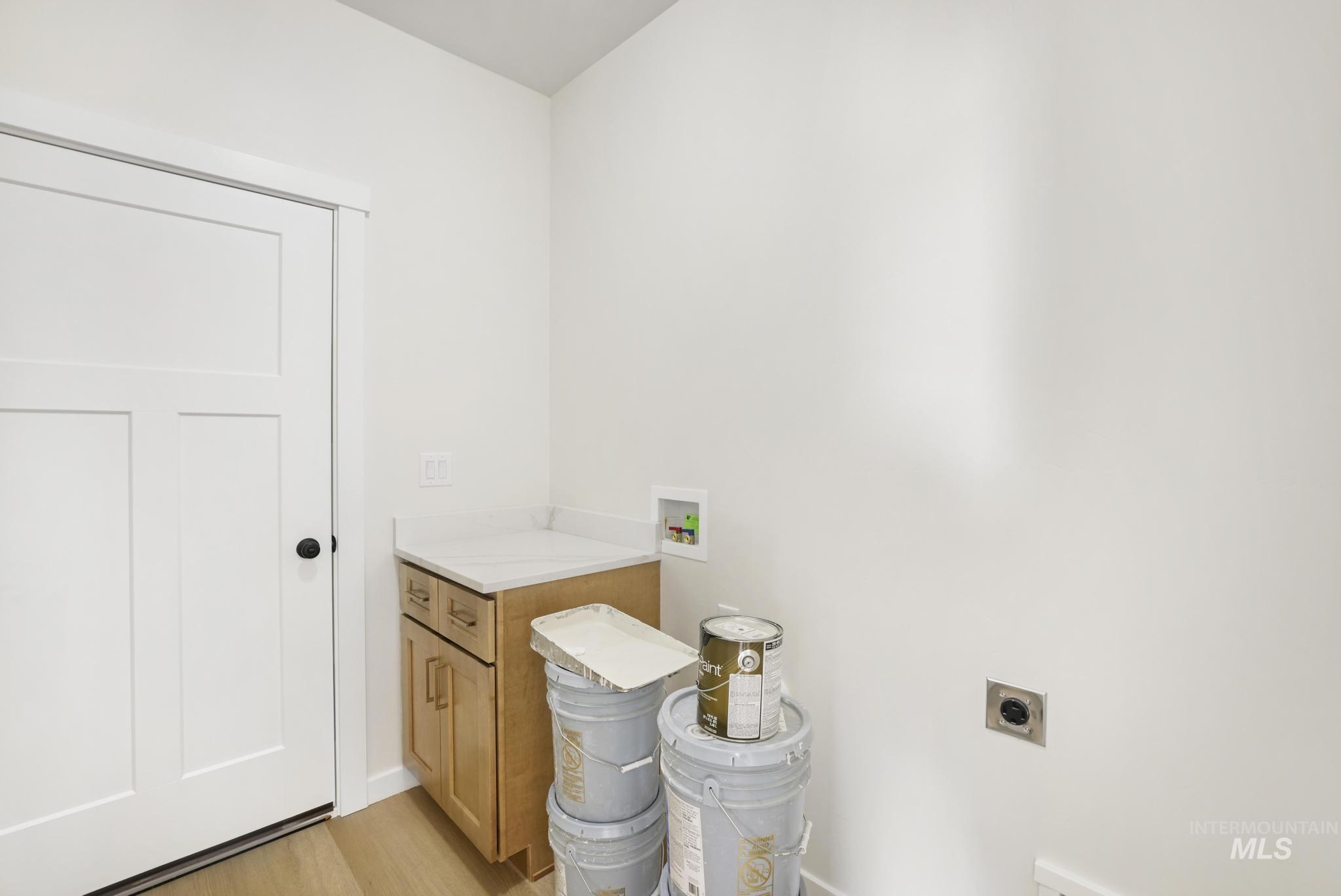 2014 Regan Street Jerome, ID 83338 - Photo 13 of 32 Laundry room featuring hookup for a washing machine, cabinet space, and hookup for an electric dryer