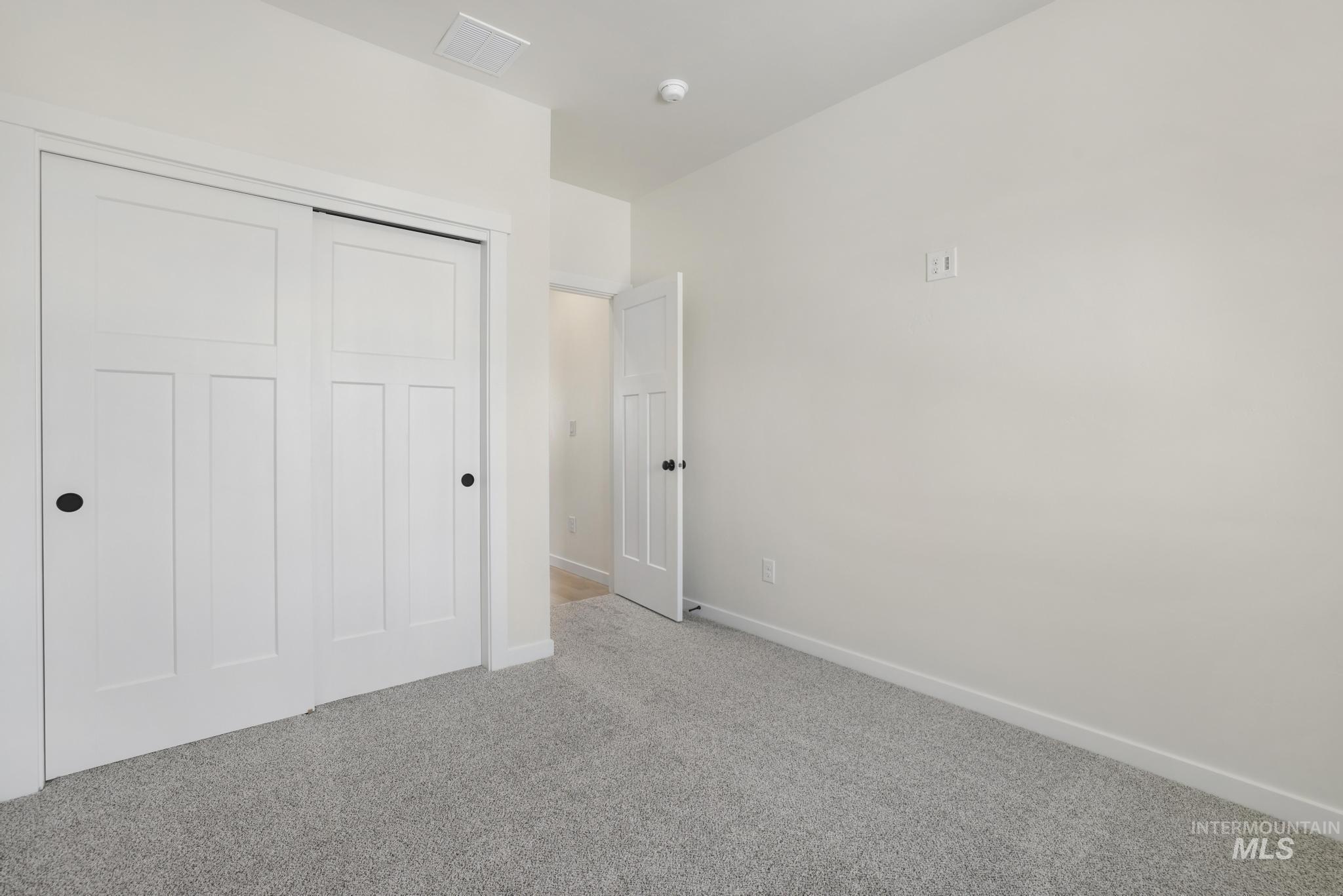 2014 Regan Street Jerome, ID 83338 - Photo 19 of 32 Bedroom featuring a closet and carpet flooring