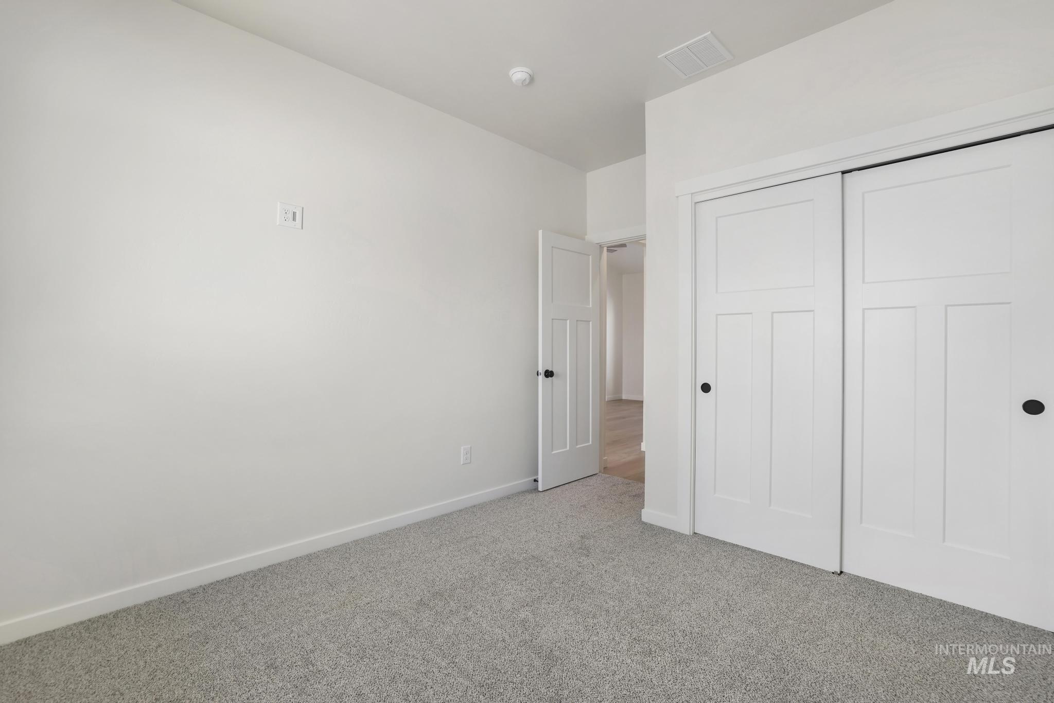 2014 Regan Street Jerome, ID 83338 - Photo 22 of 32 Bedroom with carpet flooring and a closet