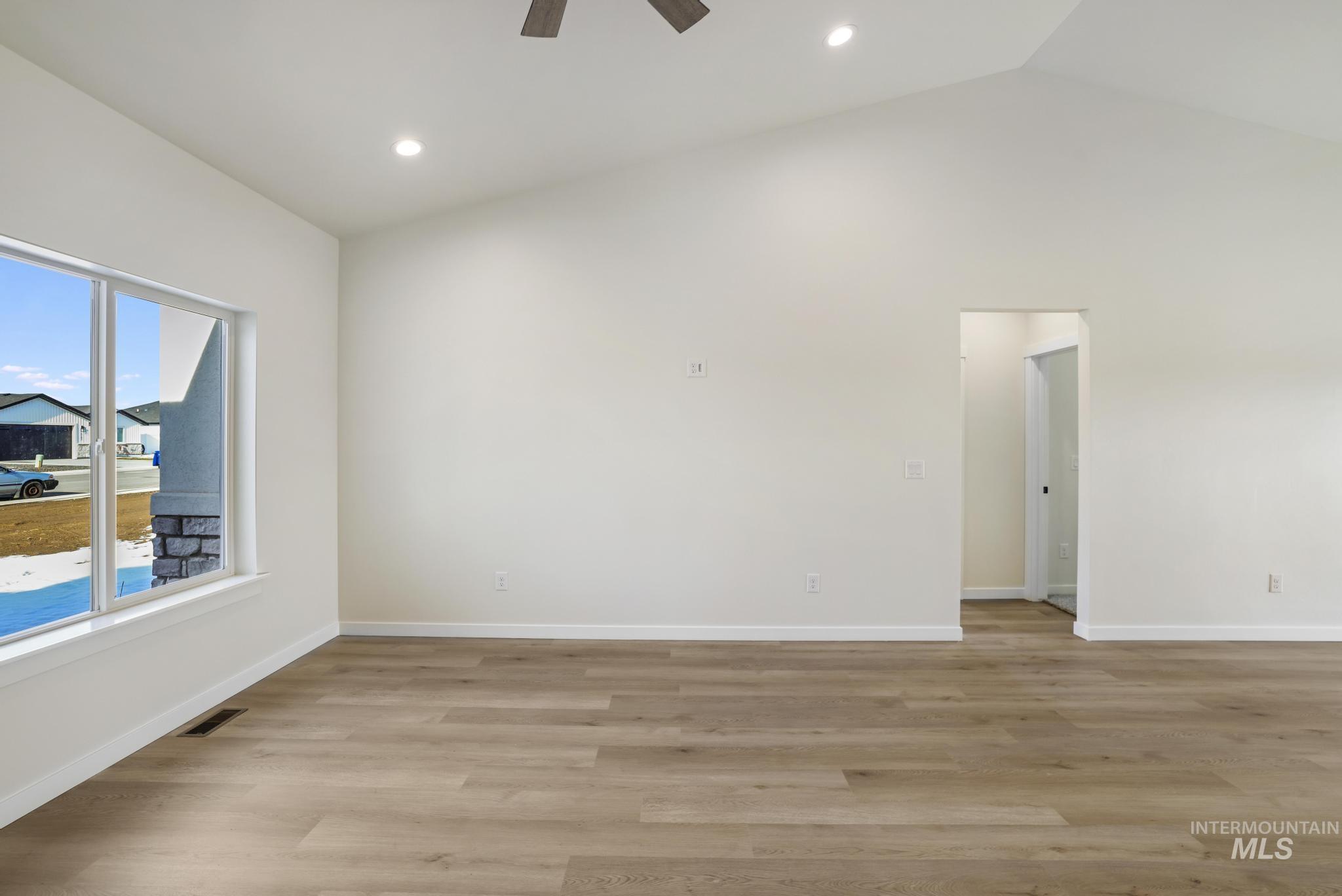 2014 Regan Street Jerome, ID 83338 - Photo 5 of 32 Living room with light wood-style flooring, high vaulted ceiling, ceiling fan, and recessed lighting