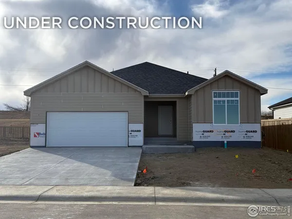 a front view of a house with a garage