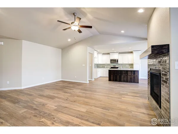 a view of a kitchen with a stove cabinets and wooden floor