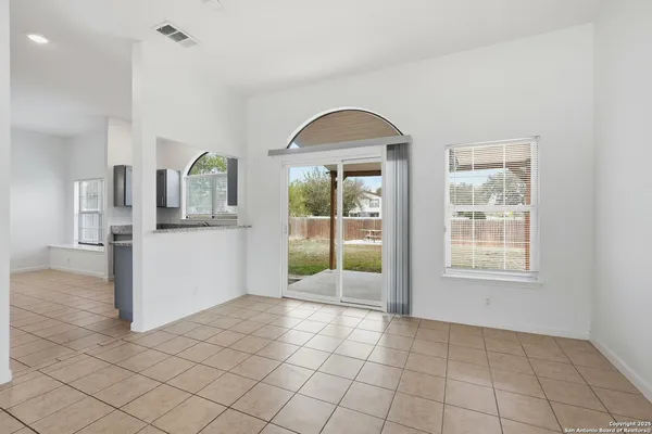 a view of a kitchen cabinets and window