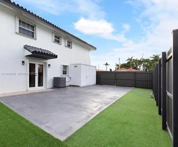 a backyard of a house with lots of green space
