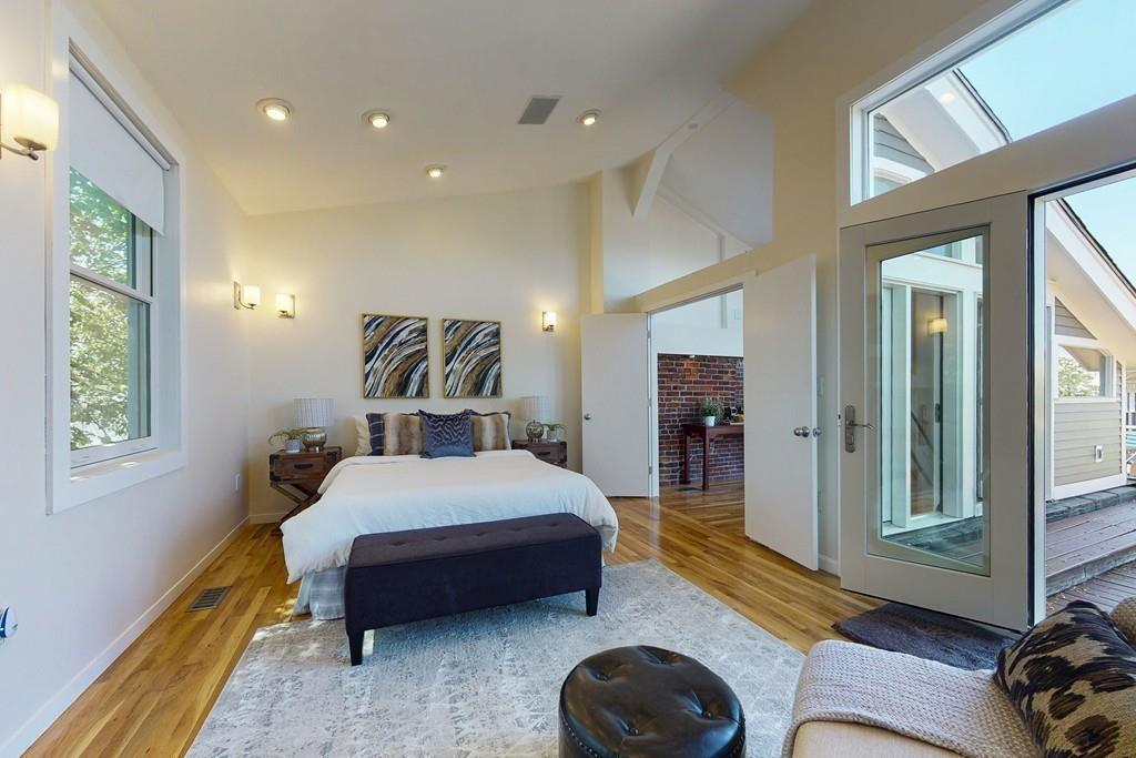 169-171 West 2nd Street Boston, MA 02127 - Photo 13 of 20 a bed room with a bed and a couch