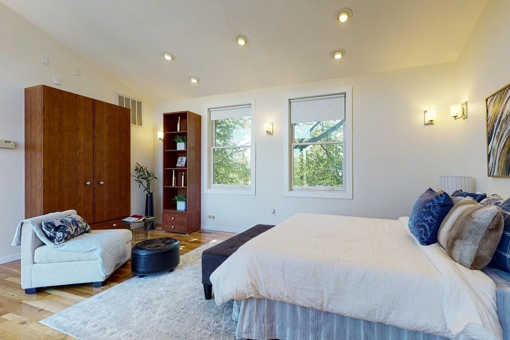 169-171 West 2nd Street Boston, MA 02127 - Photo 14 of 20 a bedroom with a bed and a couch