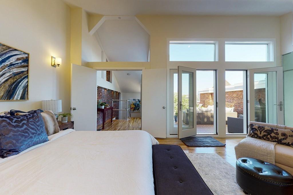 169-171 West 2nd Street Boston, MA 02127 - Photo 15 of 20 a bed room with a bed and a couch