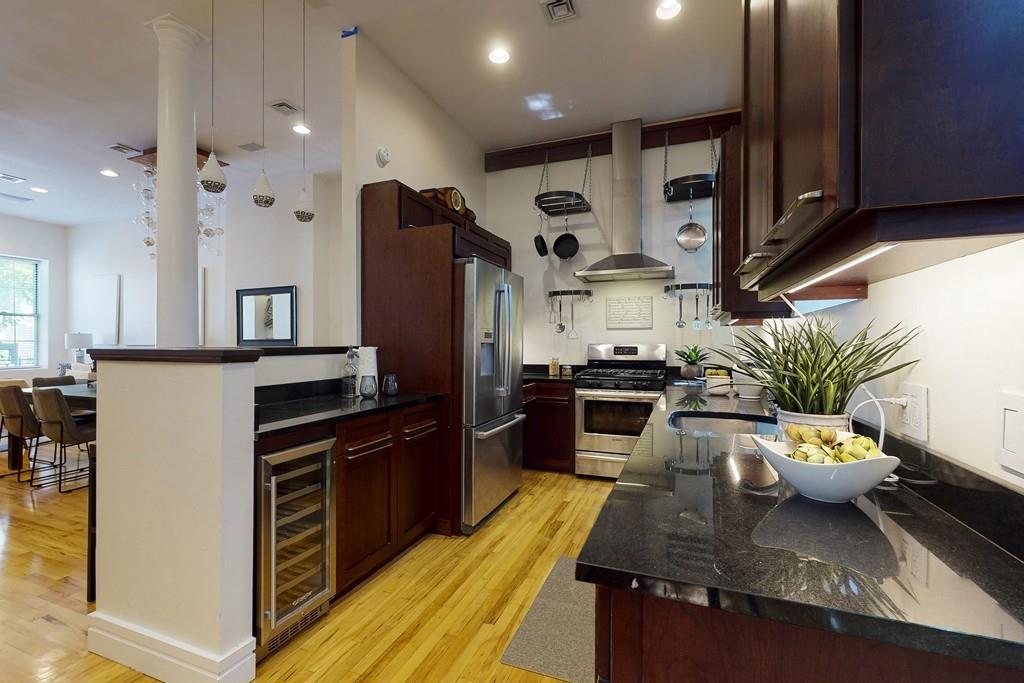 169-171 West 2nd Street Boston, MA 02127 - Photo 3 of 20 a kitchen with sink refrigerator and microwave