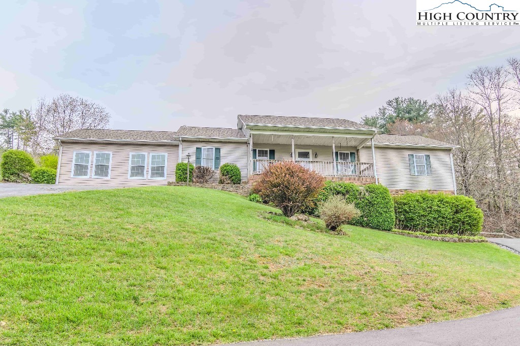 169 Violet Lane Boone, NC 28607 - Photo 1 of 27 a house view with a garden space