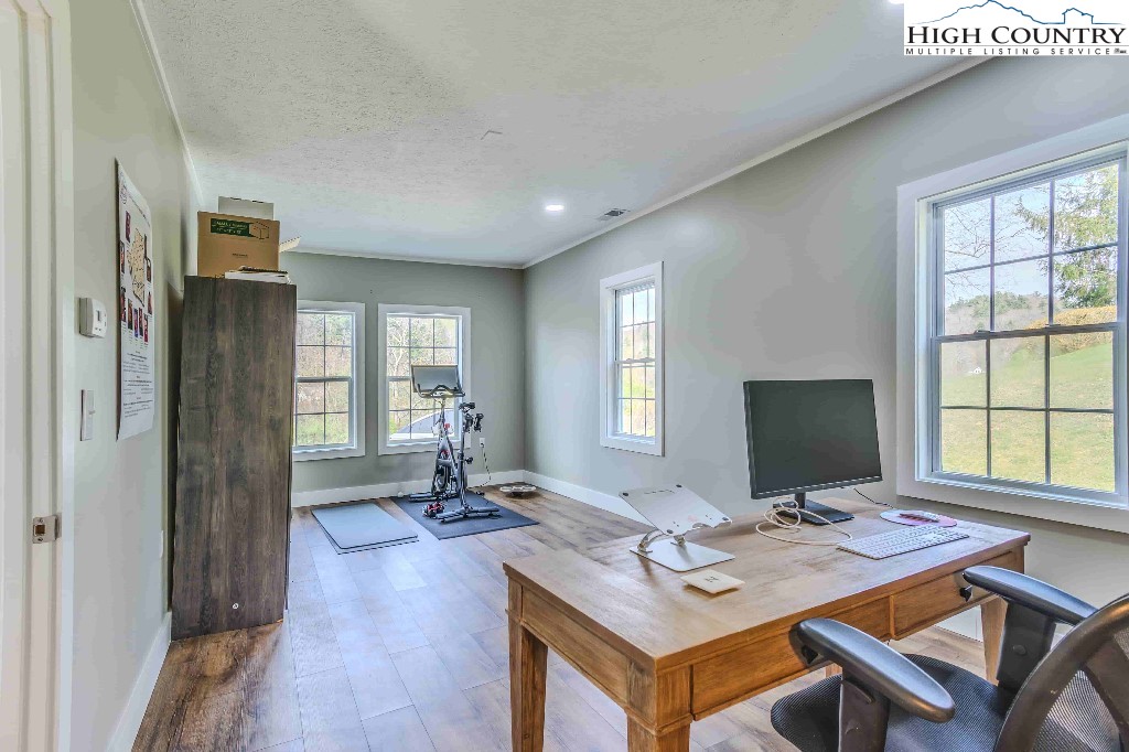 169 Violet Lane Boone, NC 28607 - Photo 16 of 27 a view of a workspace with furniture and a window