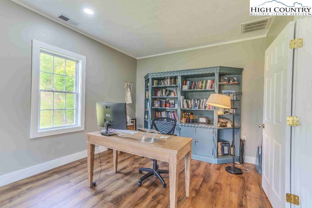 169 Violet Lane Boone, NC 28607 - Photo 17 of 27 a view of a workspace with furniture and a bookshelf