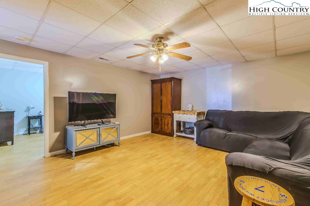 169 Violet Lane Boone, NC 28607 - Photo 20 of 27 a living room with furniture and a flat screen tv