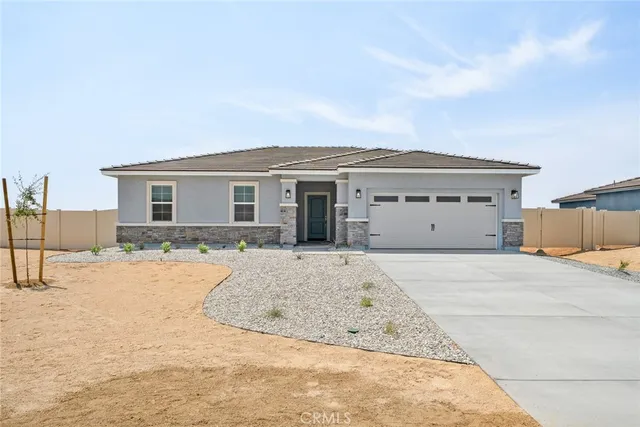 a view of a house with snow on the background