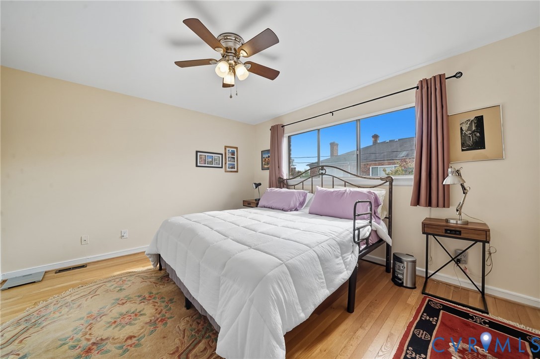 403 North Hamilton Street, Unit J Richmond, VA 23221 - Photo 15 of 27 a bedroom with a bed and a chandelier