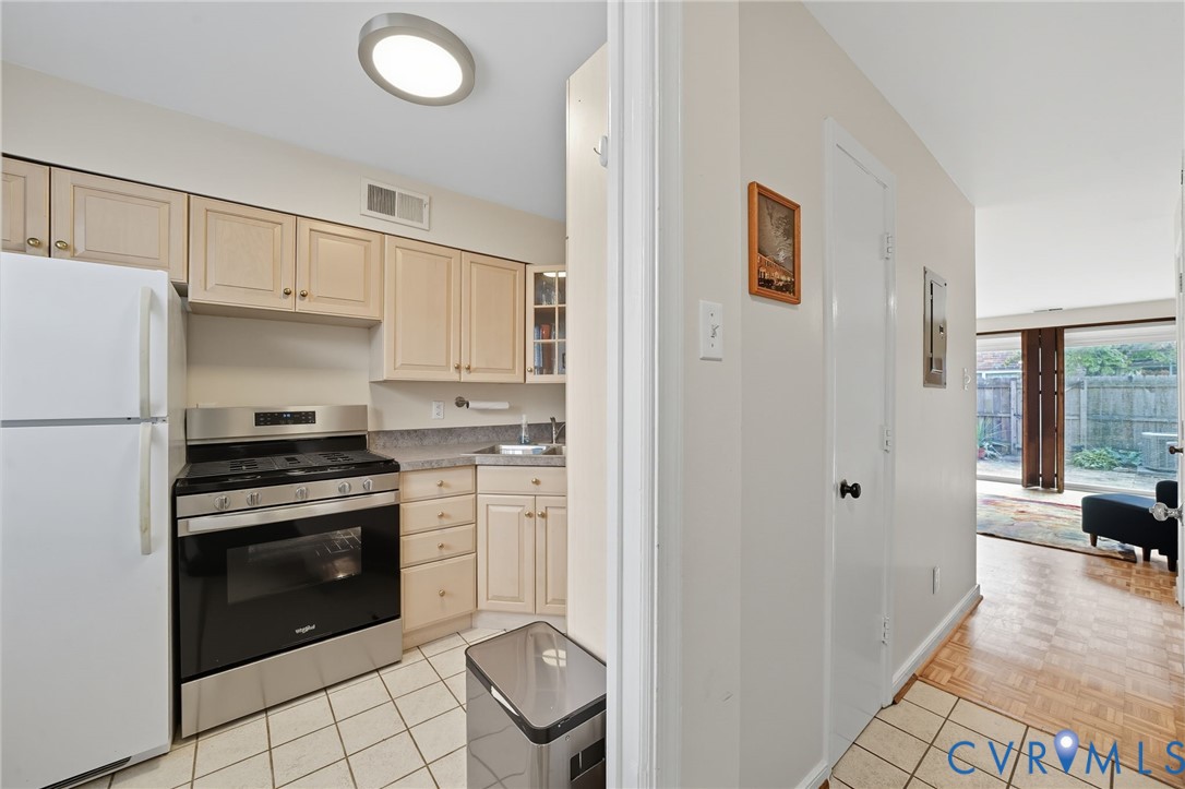 403 North Hamilton Street, Unit J Richmond, VA 23221 - Photo 10 of 27 a kitchen with cabinets and stainless steel appliances