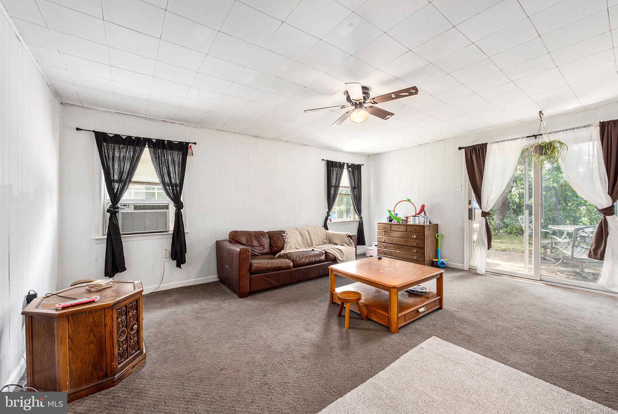1306 Susan Avenue Croydon, PA 19021 - Photo 13 of 29 a living room with furniture and a flat screen tv