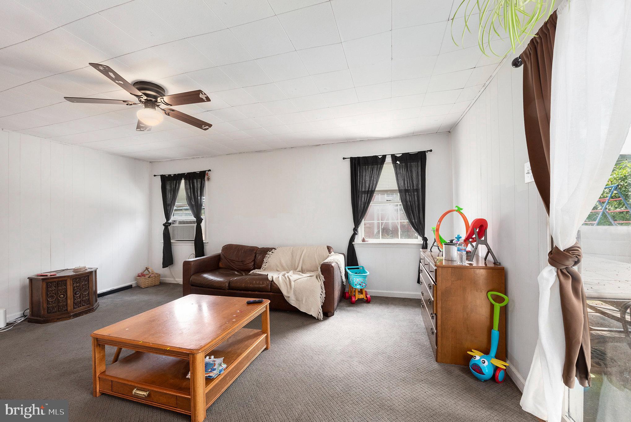 1306 Susan Avenue Croydon, PA 19021 - Photo 14 of 29 a living room with furniture and a flat screen tv