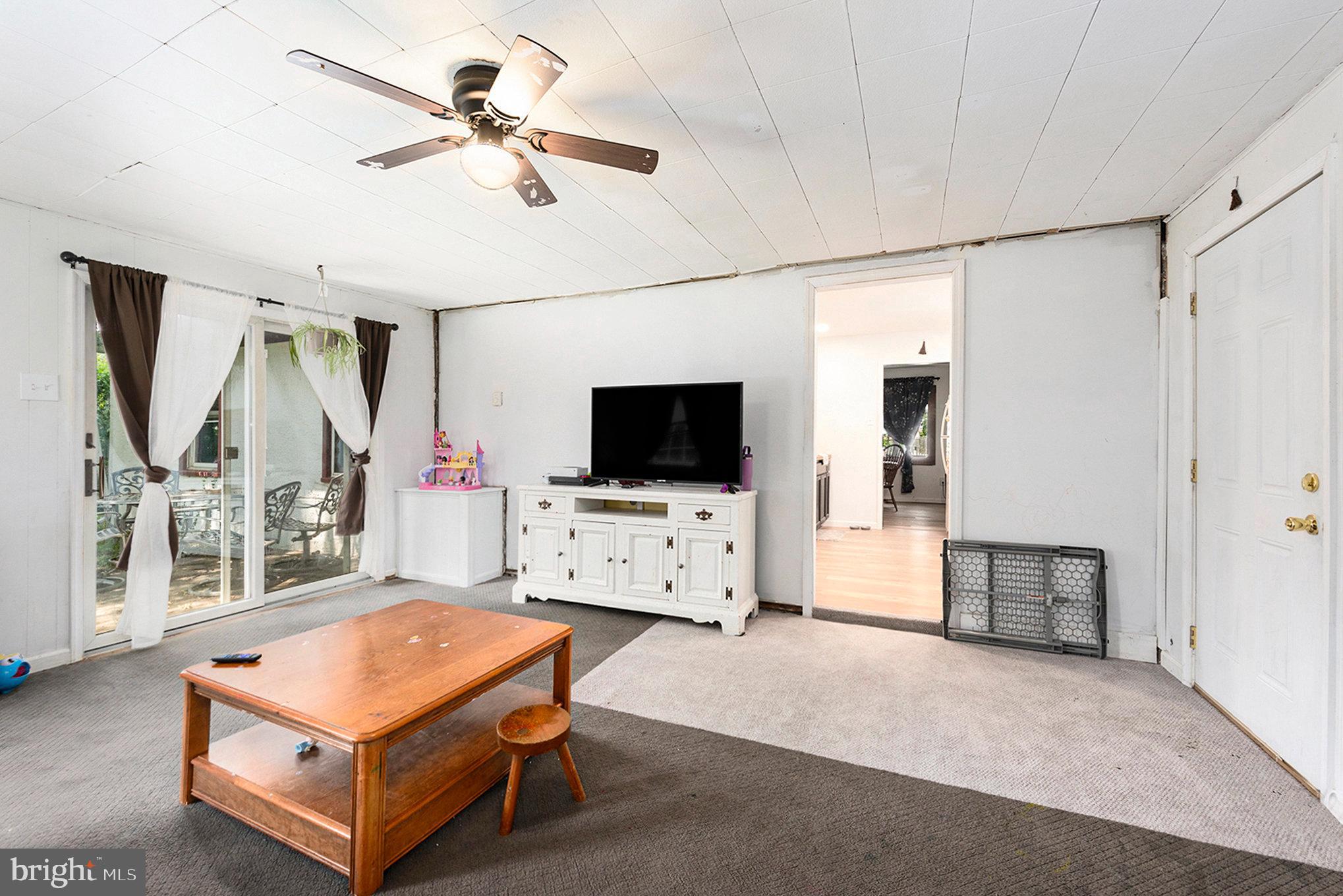 1306 Susan Avenue Croydon, PA 19021 - Photo 15 of 29 a living room with furniture and a flat screen tv