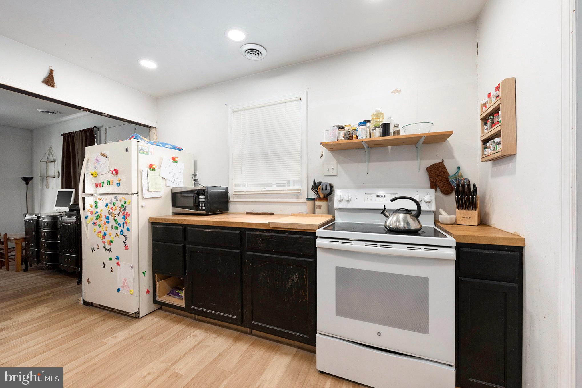 1306 Susan Avenue Croydon, PA 19021 - Photo 16 of 29 a kitchen with stainless steel appliances granite countertop a refrigerator a stove and wooden floors