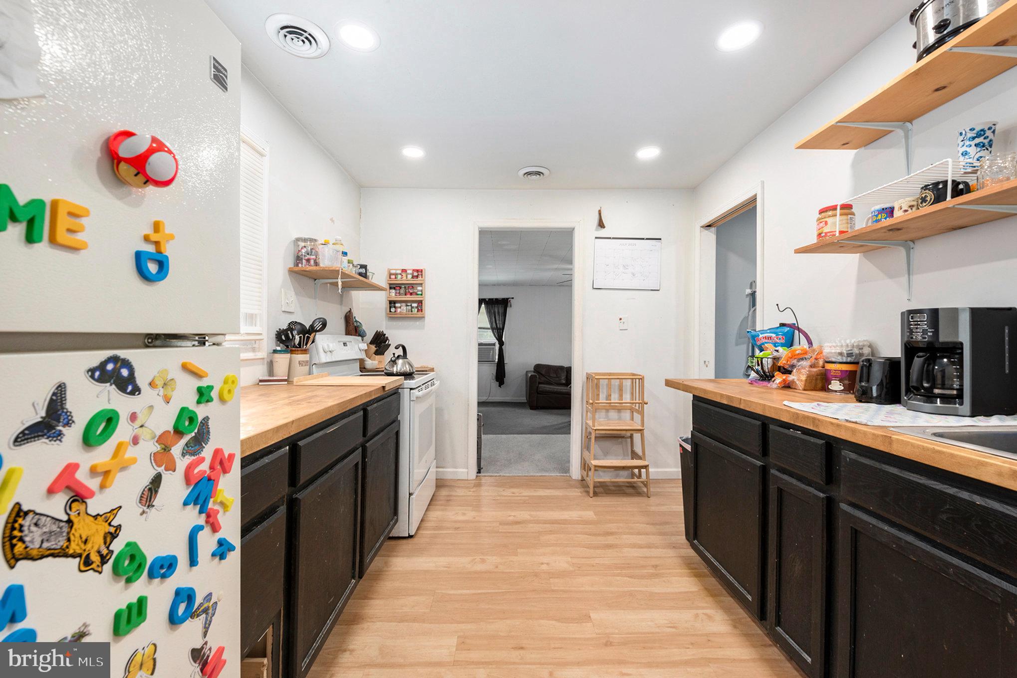 1306 Susan Avenue Croydon, PA 19021 - Photo 17 of 29 a kitchen with stainless steel appliances wooden floor and sink