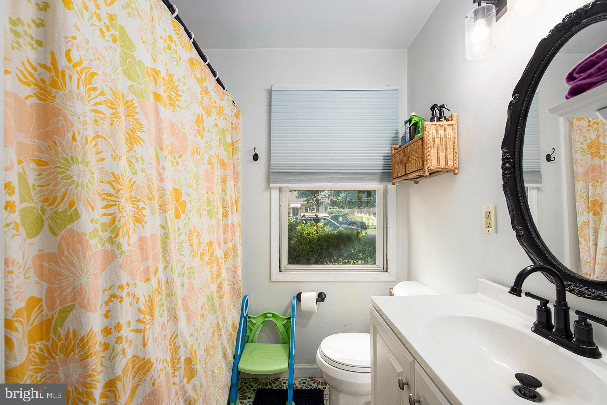 1306 Susan Avenue Croydon, PA 19021 - Photo 22 of 29 a bathroom with a sink toilet and a mirror
