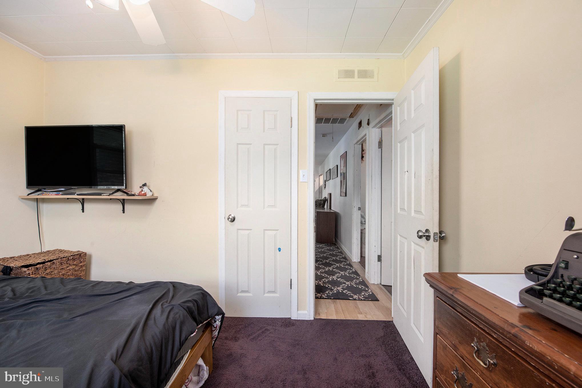 1306 Susan Avenue Croydon, PA 19021 - Photo 23 of 29 a bedroom with a bed and a flat screen tv