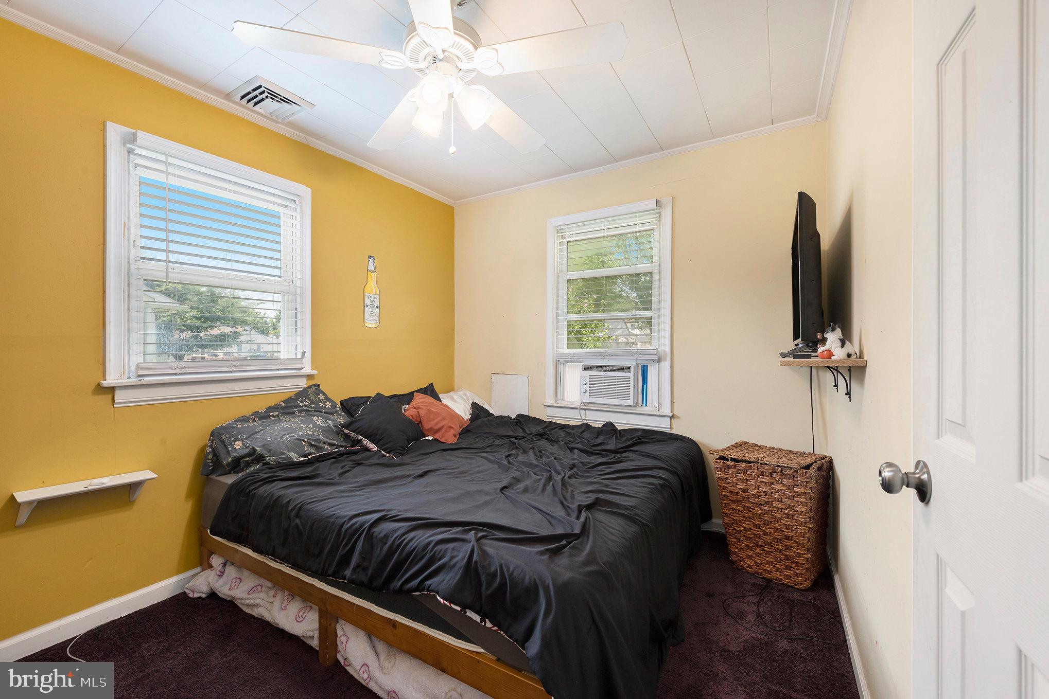 1306 Susan Avenue Croydon, PA 19021 - Photo 24 of 29 a bedroom with a bed window and flat screen tv