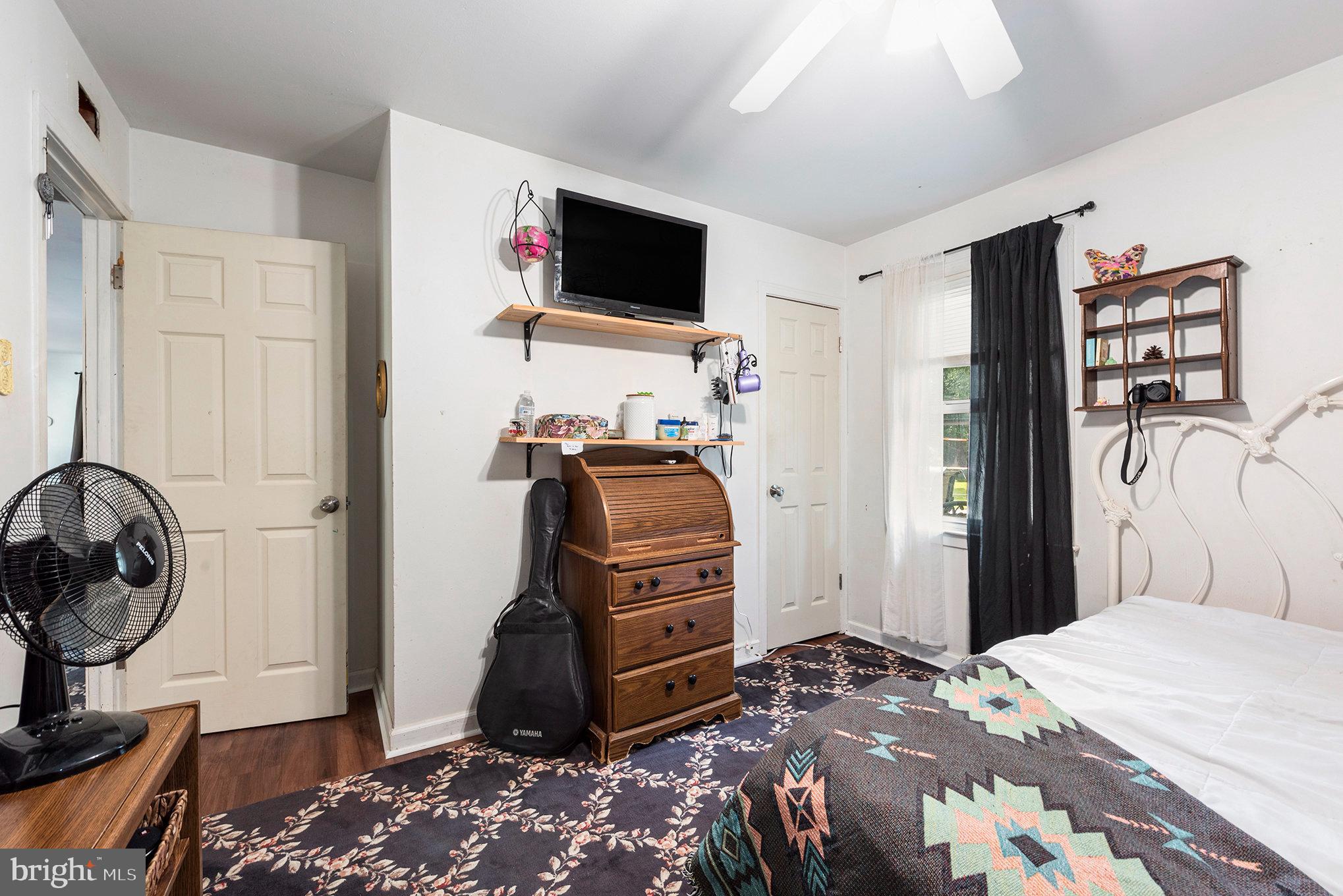 1306 Susan Avenue Croydon, PA 19021 - Photo 29 of 29 a bedroom with a bed and a flat tv screen