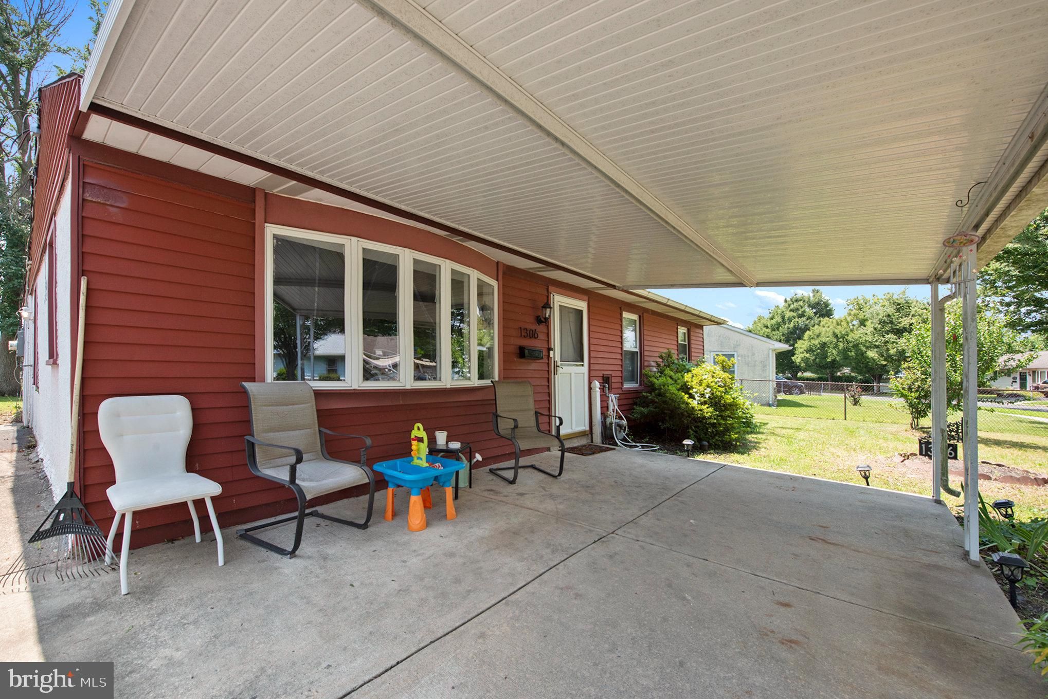 1306 Susan Avenue Croydon, PA 19021 - Photo 4 of 29 a view of a patio with a table and chairs under an umbrella