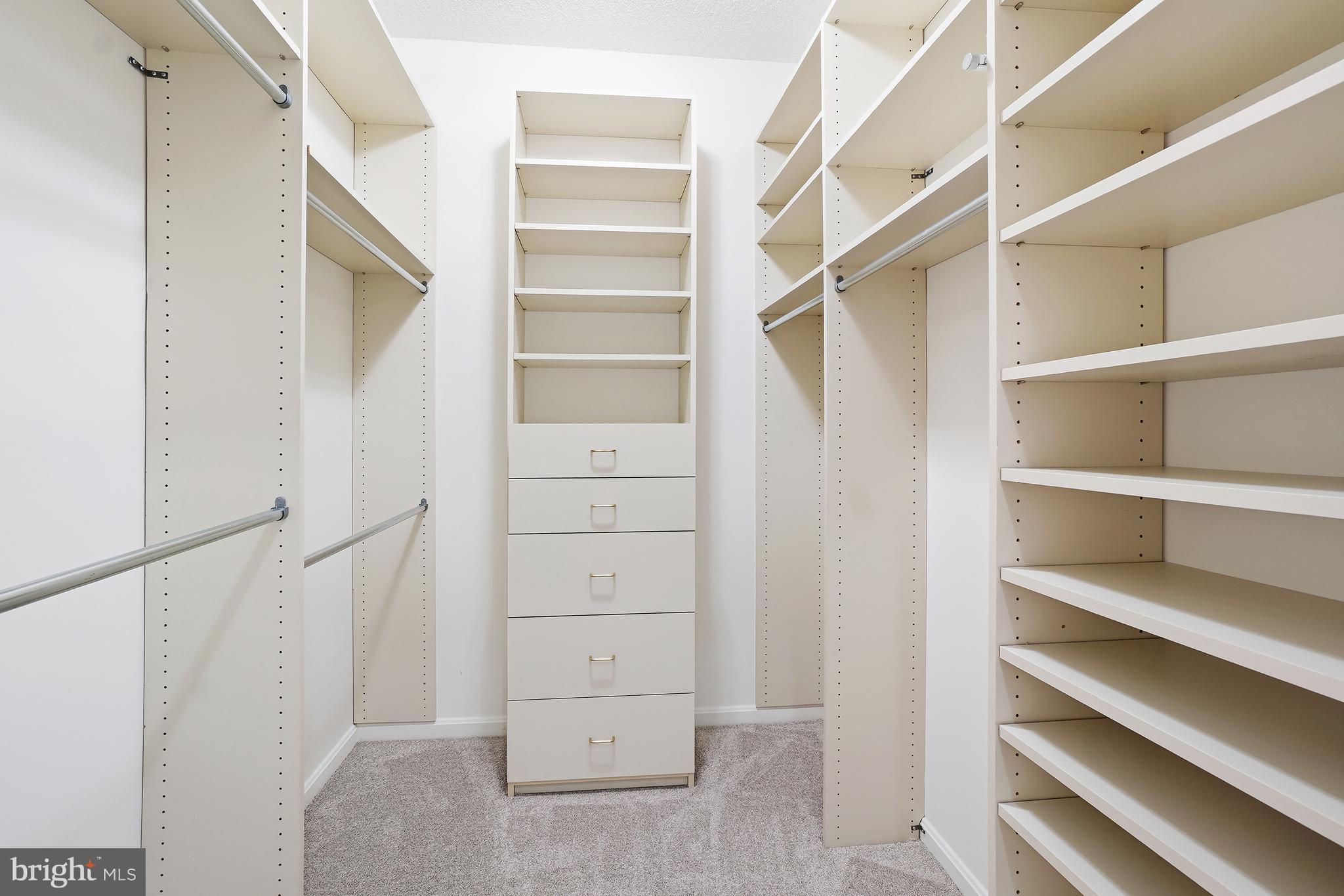 3210 North Leisure World Boulevard, Unit 1001 Silver Spring, MD 20906 - Photo 16 of 58 a view of walk in closet with empty racks