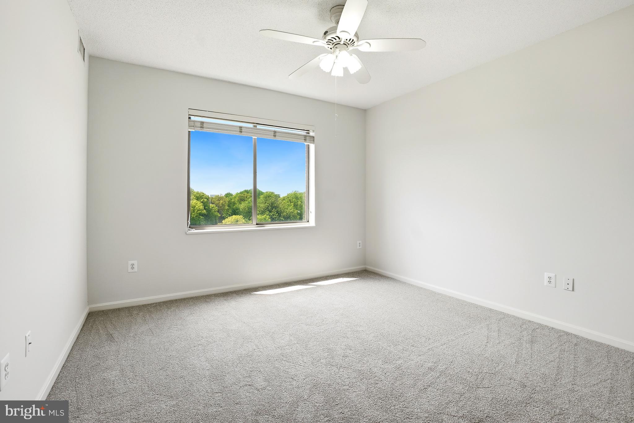 3210 North Leisure World Boulevard, Unit 1001 Silver Spring, MD 20906 - Photo 21 of 58 an empty room with a window