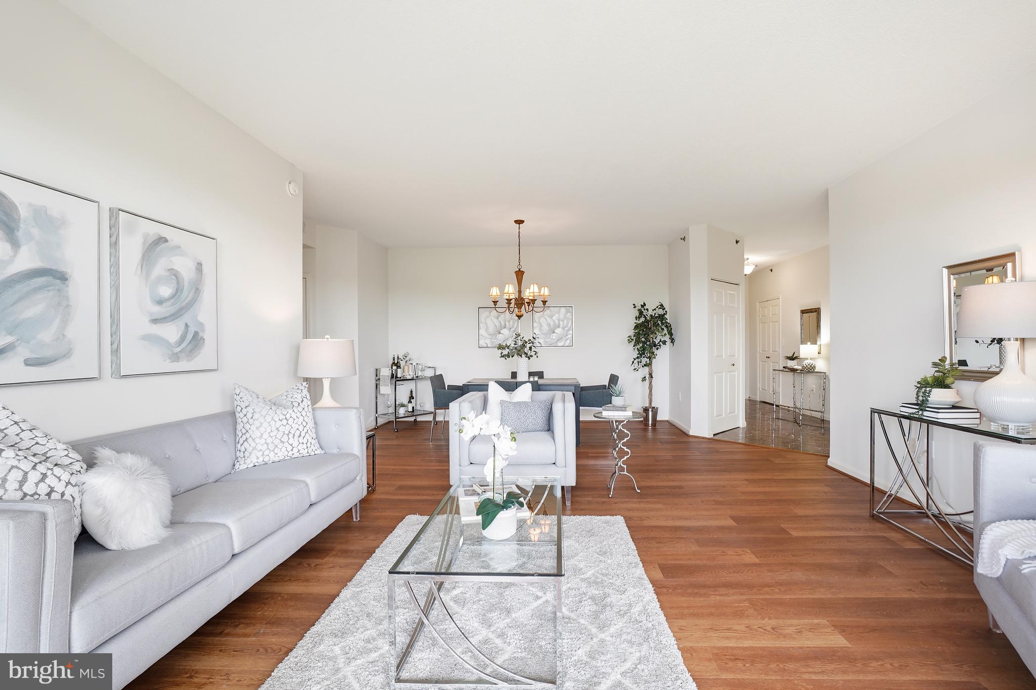 3210 North Leisure World Boulevard, Unit 1001 Silver Spring, MD 20906 - Photo 6 of 58 a living room with furniture and a wooden floor