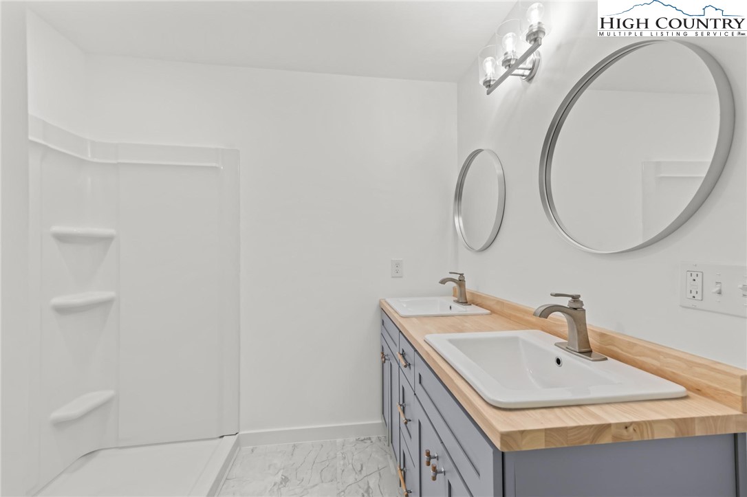 219 Hillandale Drive Boone, NC 28607 - Photo 13 of 33 a bathroom with a sink and a mirror