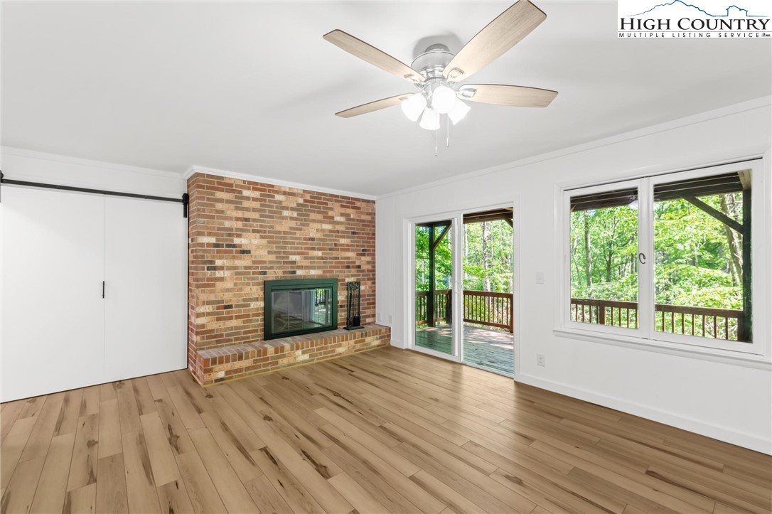 219 Hillandale Drive Boone, NC 28607 - Photo 19 of 33 a view of an empty room with wooden floor and a window