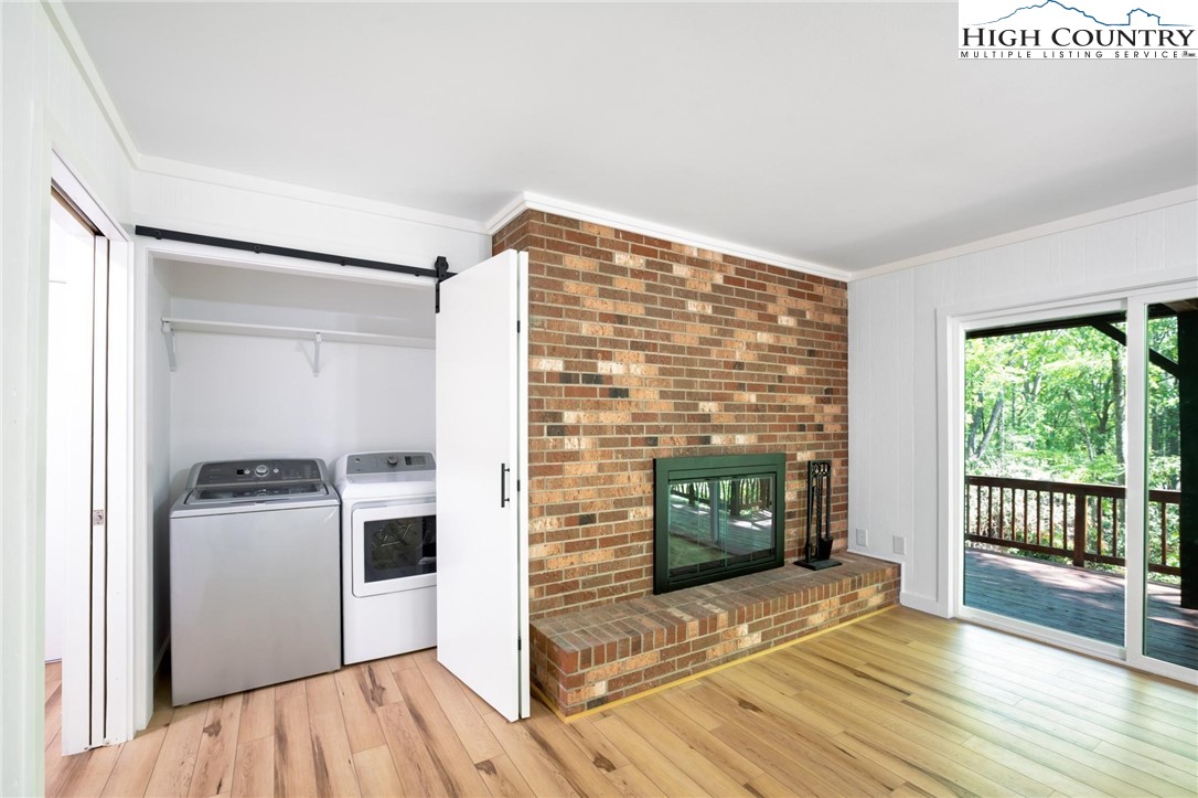 219 Hillandale Drive Boone, NC 28607 - Photo 20 of 33 workspace with wooden floor a fireplace and windows