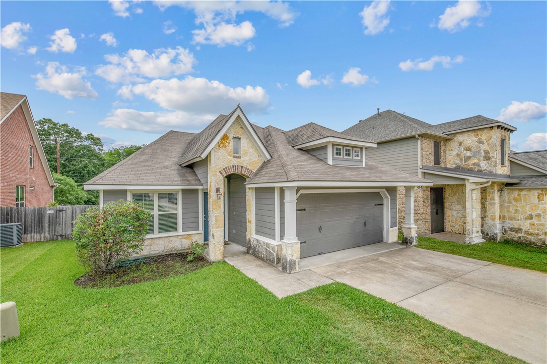3014 Positano Loop Bryan, TX 77808 - Photo 2 of 23 front view of a house with a yard