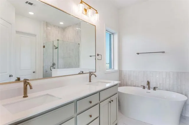 a view of a livingroom with a fireplace and chandelier