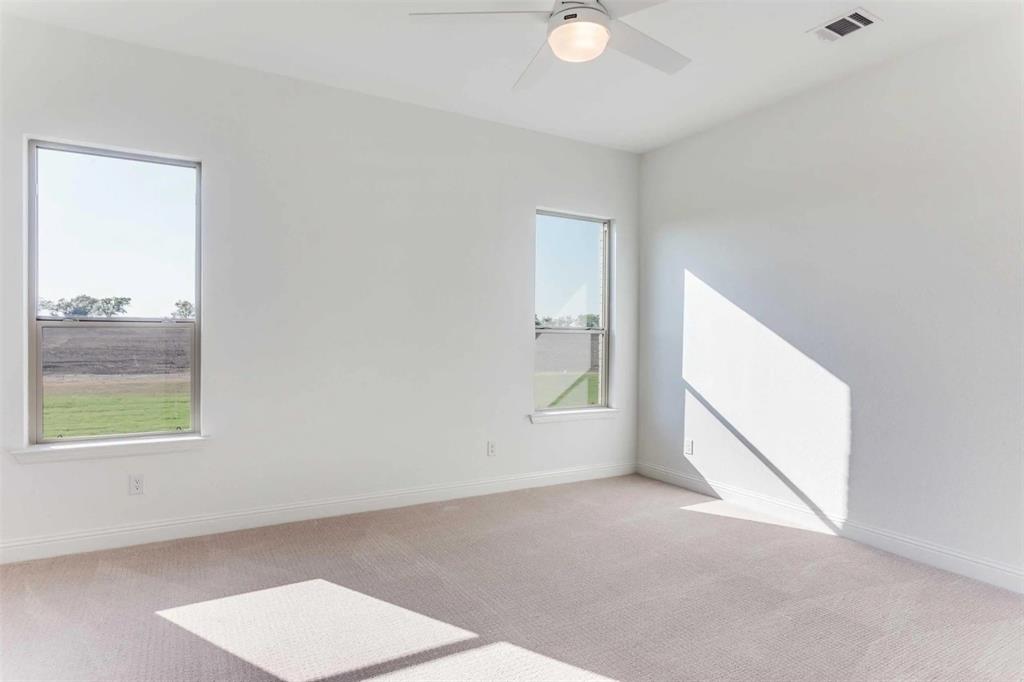 179 Galena Street Rhome, TX 76078 - Photo 13 of 17 an empty room with windows