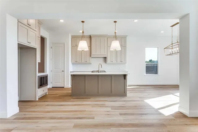 a large bathroom with a granite countertop sink