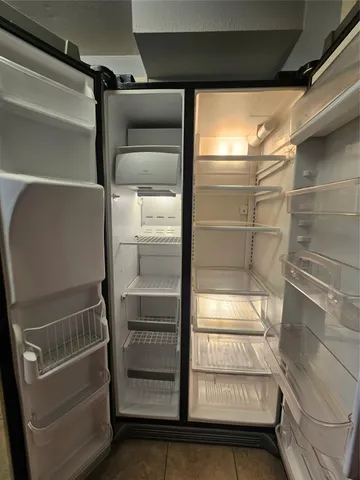 a stove top oven sitting inside of a kitchen