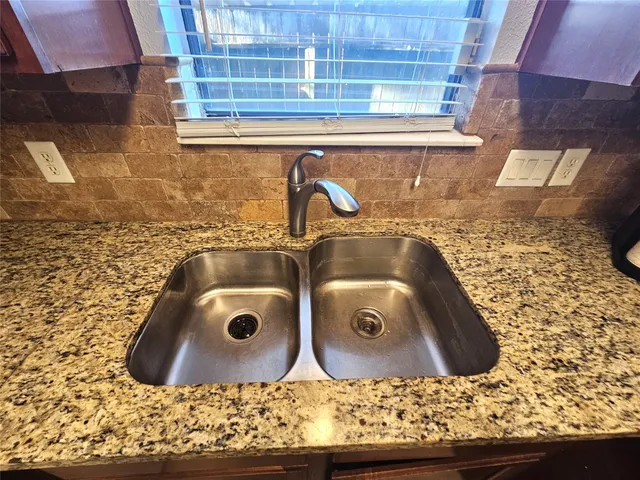a view of a wooden door of the house