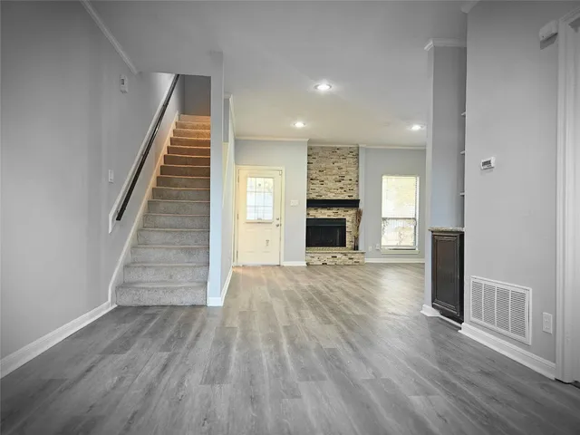 a bathroom with a granite countertop sink a toilet and a mirror