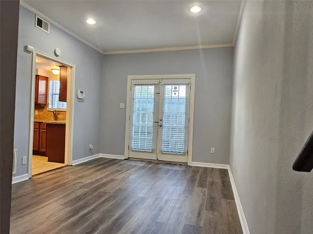 a kitchen with a sink stove top oven and cabinets
