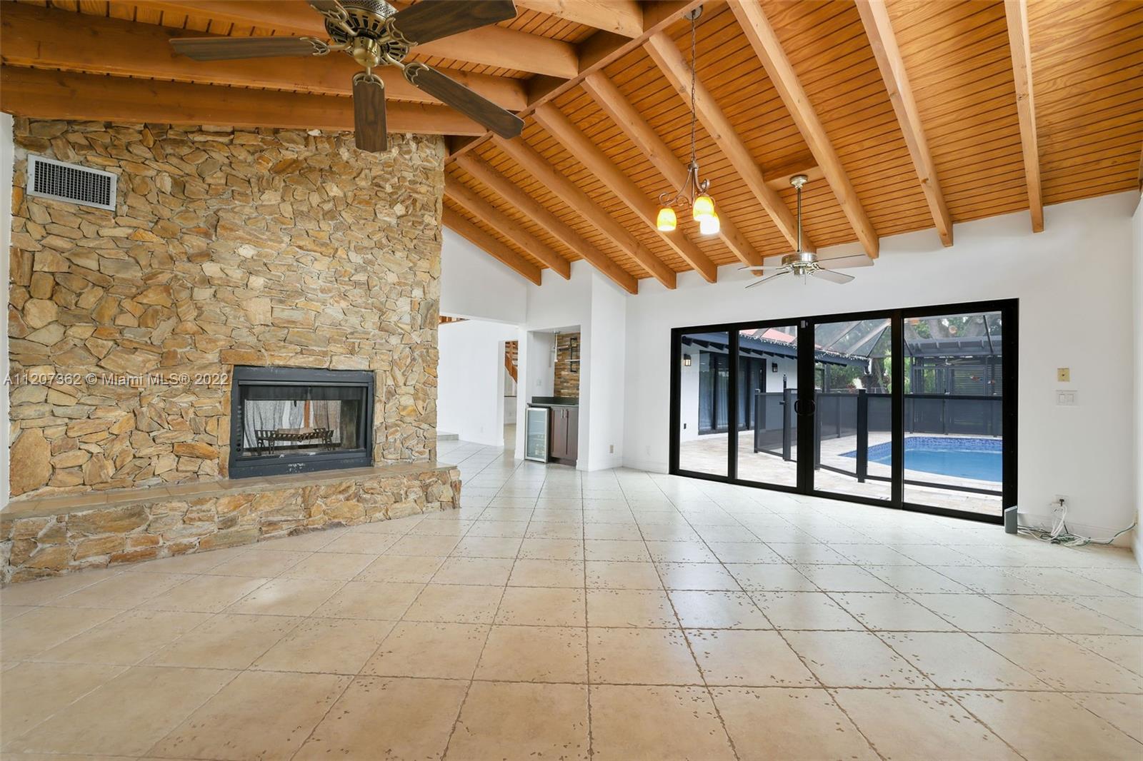 1501 Northwest 12th Terrace Boca Raton, FL 33486 - Photo 12 of 49 a view of an empty room with a fireplace