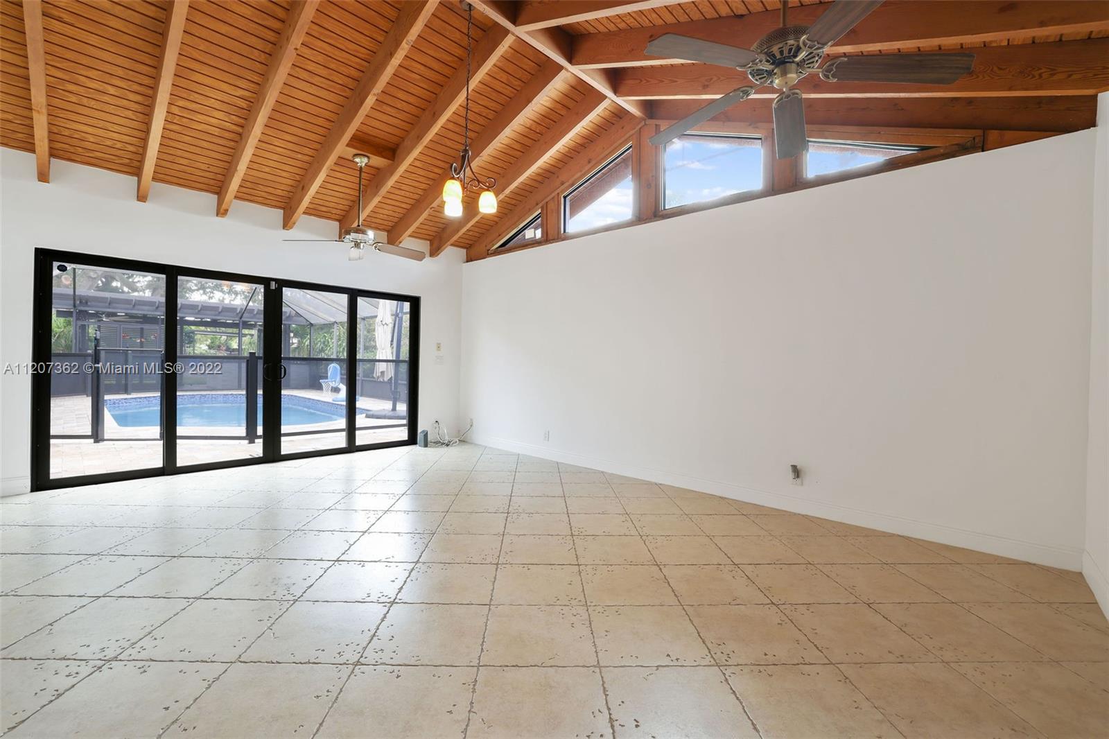 1501 Northwest 12th Terrace Boca Raton, FL 33486 - Photo 13 of 49 a view of an empty room with a window