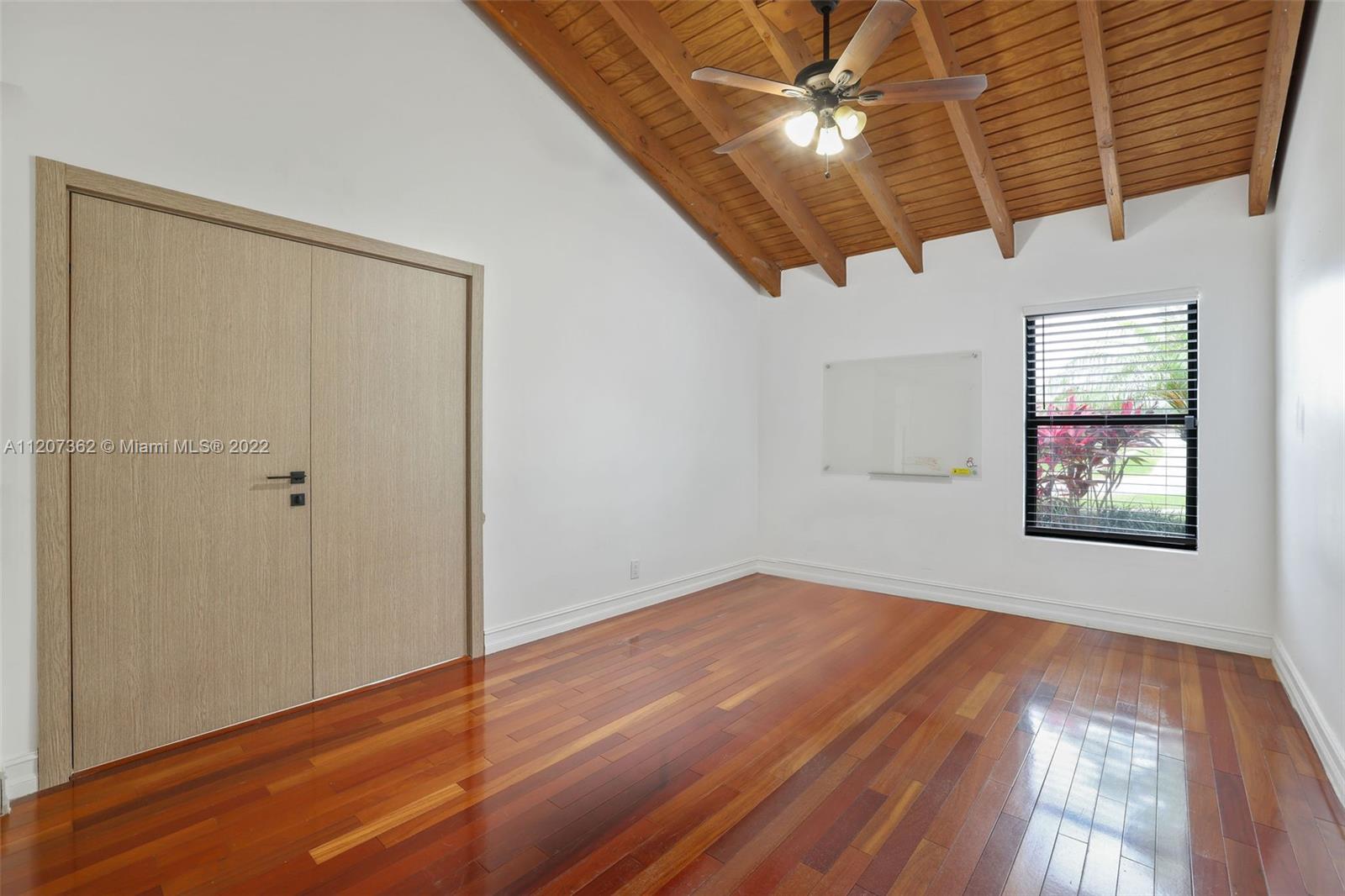 1501 Northwest 12th Terrace Boca Raton, FL 33486 - Photo 15 of 49 a view of an empty room with a window
